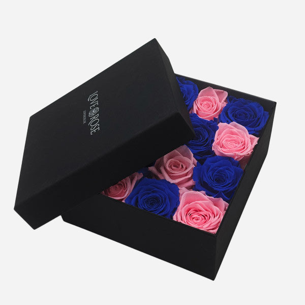 Preserved Blue and Pink Roses in a Black Box