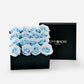 A large black luxury box with 16 blue infinity roses 