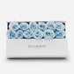 White luxury box of 12 blue forever roses. 