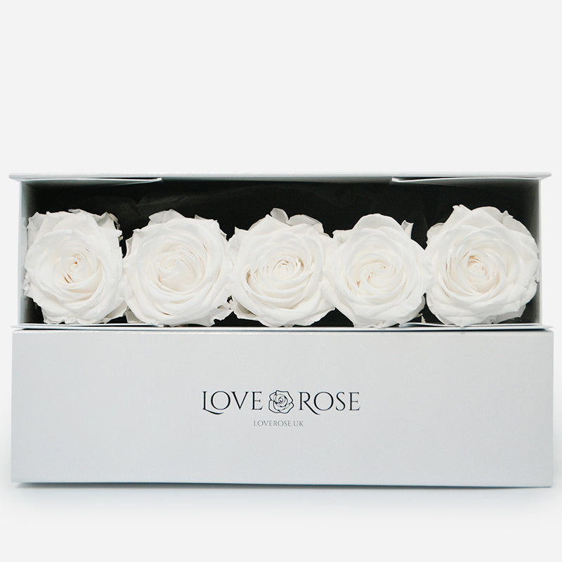 5 luxury white forever roses arranged in a luxury box