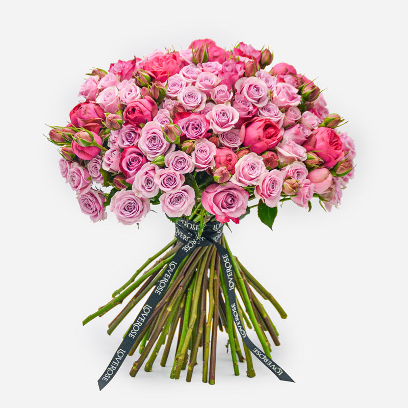 Luxury hand-tied rose bouquet comprising of bright and deep pink roses.