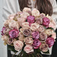 long stem mixed roses holded by a girl